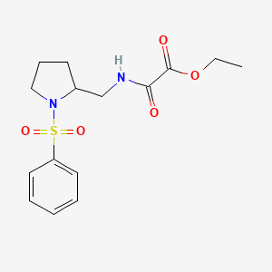 molecular formula C15H20N2O5S B2516256 Ethyl 2-oxo-2-(((1-(phenylsulfonyl)pyrrolidin-2-yl)methyl)amino)acetate CAS No. 896268-04-5