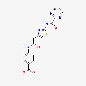 molecular formula C18H15N5O4S B2516504 Methyl-4-(2-(2-(Pyrimidin-2-carboxamido)thiazol-4-yl)acetamido)benzoat CAS No. 1286698-90-5