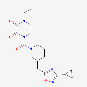 B2527891 1-(3-((3-Cyclopropyl-1,2,4-oxadiazol-5-yl)methyl)piperidine-1-carbonyl)-4-ethylpiperazine-2,3-dione CAS No. 1705550-28-2