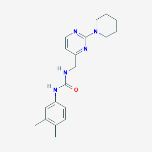 1-(3,4-Dimethylphenyl)-3-((2-(piperidin-1-yl)pyrimidin-4-yl)methyl)urea