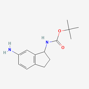 (6-Aminoindan-1-yl)carbamic acid tert-butyl ester