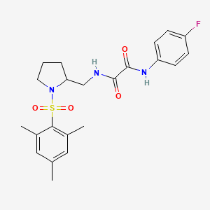 molecular formula C22H26FN3O4S B2536747 N1-(4-fluorophenyl)-N2-((1-(mesitylsulfonyl)pyrrolidin-2-yl)methyl)oxalamide CAS No. 896281-58-6