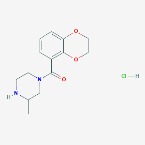 molecular formula C14H19ClN2O3 B2536903 (2,3-Dihydrobenzo[b][1,4]dioxin-5-yl)(3-methylpiperazin-1-yl)methanone hydrochloride CAS No. 1353985-90-6