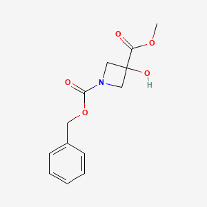 molecular formula C13H15NO5 B2536991 1-Benzyl 3-methyl 3-hydroxyazetidine-1,3-dicarboxylate CAS No. 1884493-20-2