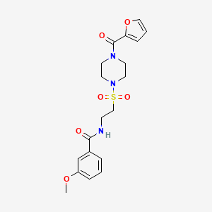 molecular formula C19H23N3O6S B2537443 N-(2-{[4-(furan-2-carbonyl)piperazin-1-yl]sulfonyl}ethyl)-3-methoxybenzamide CAS No. 899979-23-8