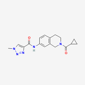 molecular formula C17H19N5O2 B2539476 N-(2-(cyclopropanecarbonyl)-1,2,3,4-tetrahydroisoquinolin-7-yl)-1-methyl-1H-1,2,3-triazole-4-carboxamide CAS No. 1448059-09-3