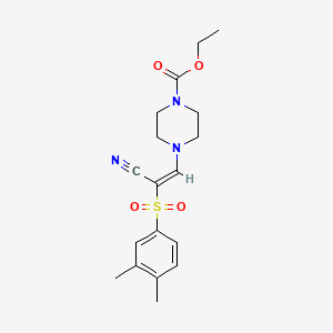 molecular formula C18H23N3O4S B2544919 (E)-ethyl 4-(2-cyano-2-((3,4-dimethylphenyl)sulfonyl)vinyl)piperazine-1-carboxylate CAS No. 885186-14-1