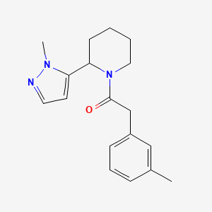 molecular formula C18H23N3O B2546174 2-(3-Methylphenyl)-1-[2-(2-methylpyrazol-3-yl)piperidin-1-yl]ethanone CAS No. 2319801-14-2