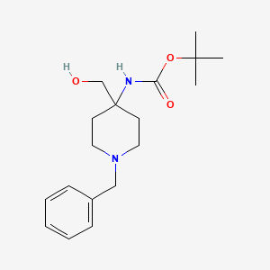 molecular formula C18H28N2O3 B2547743 CC(C)(C)OC(=O)NC1(CO)Ccn(CC2=CC=CC=C2)CC1 CAS No. 1279815-88-1