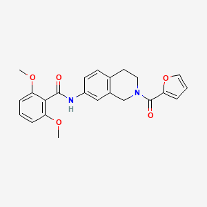 N-(2-(furan-2-carbonyl)-1,2,3,4-tetrahydroisoquinolin-7-yl)-2,6-dimethoxybenzamide