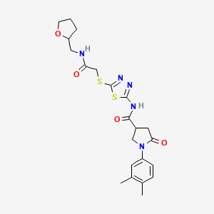 1-(3,4-dimethylphenyl)-5-oxo-N-(5-((2-oxo-2-(((tetrahydrofuran-2-yl)methyl)amino)ethyl)thio)-1,3,4-thiadiazol-2-yl)pyrrolidine-3-carboxamide