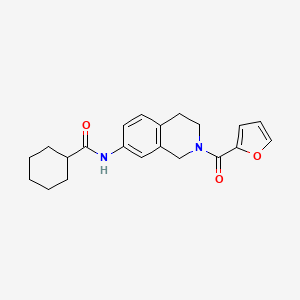 molecular formula C21H24N2O3 B2555957 N-(2-(furan-2-carbonyl)-1,2,3,4-tetrahydroisoquinolin-7-yl)cyclohexanecarboxamide CAS No. 955741-44-3