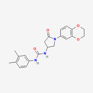 molecular formula C21H23N3O4 B2559373 1-(1-(2,3-Dihydrobenzo[b][1,4]dioxin-6-yl)-5-oxopyrrolidin-3-yl)-3-(3,4-dimethylphenyl)urea CAS No. 877641-05-9