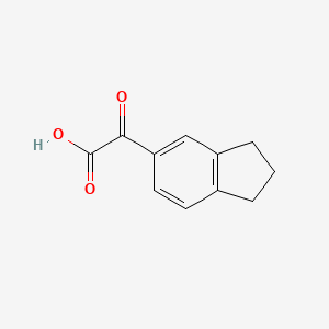 molecular formula C11H10O3 B2561026 2-(2,3-dihydro-1H-inden-5-yl)-2-oxoacetic acid CAS No. 720707-40-4