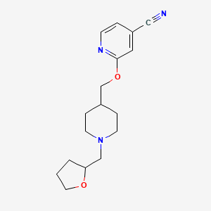 B2564900 2-[[1-(Oxolan-2-ylmethyl)piperidin-4-yl]methoxy]pyridine-4-carbonitrile CAS No. 2415462-55-2
