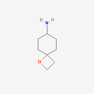 molecular formula C8H15NO B2565295 1-氧代螺[3.5]壬烷-7-胺 CAS No. 2323033-45-8