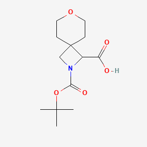 molecular formula C13H21NO5 B2572883 2-[(叔丁氧羰基)羰基]-7-氧杂-2-氮杂螺[3.5]壬烷-1-羧酸 CAS No. 1955492-38-2