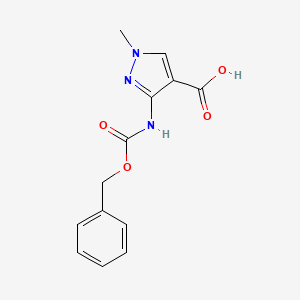 molecular formula C13H13N3O4 B2577313 1-Methyl-3-(phenylmethoxycarbonylamino)pyrazole-4-carboxylic acid CAS No. 2248306-04-7