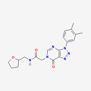 molecular formula C19H22N6O3 B2577330 2-(3-(3,4-dimethylphenyl)-7-oxo-3H-[1,2,3]triazolo[4,5-d]pyrimidin-6(7H)-yl)-N-((tetrahydrofuran-2-yl)methyl)acetamide CAS No. 893917-43-6