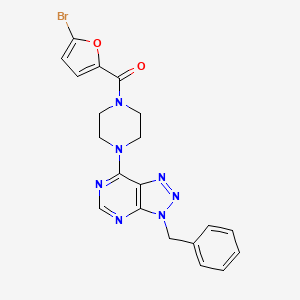molecular formula C20H18BrN7O2 B2578423 (4-(3-苄基-3H-[1,2,3]三唑并[4,5-d]嘧啶-7-基)哌嗪-1-基)(5-溴呋喃-2-基)甲酮 CAS No. 920391-09-9