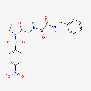 molecular formula C19H20N4O7S B2579996 N1-苄基-N2-((3-((4-硝基苯基)磺酰基)恶唑烷-2-基)甲基)草酰胺 CAS No. 868981-87-7