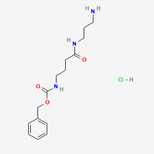 molecular formula C15H24ClN3O3 B2582689 Benzyl N-{3-[(3-aminopropyl)carbamoyl]propyl}carbamate hydrochloride CAS No. 2140316-74-9