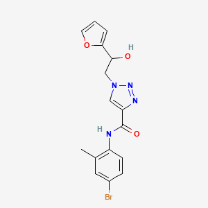 molecular formula C16H15BrN4O3 B2584829 N-(4-溴-2-甲基苯基)-1-(2-(呋喃-2-基)-2-羟乙基)-1H-1,2,3-三唑-4-甲酰胺 CAS No. 2034478-27-6