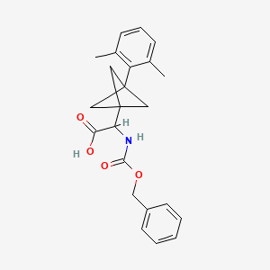 molecular formula C23H25NO4 B2585014 2-[3-(2,6-Dimethylphenyl)-1-bicyclo[1.1.1]pentanyl]-2-(phenylmethoxycarbonylamino)acetic acid CAS No. 2287262-32-0