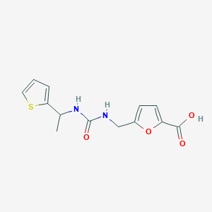 molecular formula C13H14N2O4S B2589980 Ácido 5-[({[1-(Tiofen-2-il)etil]carbamoil}amino)metil]furano-2-carboxílico CAS No. 1536284-55-5