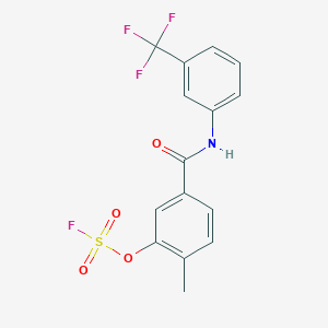 molecular formula C15H11F4NO4S B2590846 2-Fluorosulfonyloxy-1-methyl-4-[[3-(trifluoromethyl)phenyl]carbamoyl]benzene CAS No. 2411241-79-5