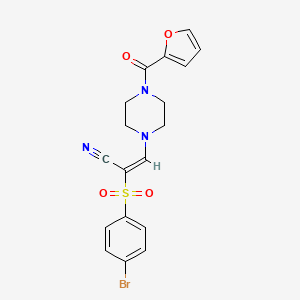 molecular formula C18H16BrN3O4S B2594141 2-((4-Bromophenyl)sulfonyl)-3-(4-(2-furylcarbonyl)piperazinyl)prop-2-enenitrile CAS No. 1025214-96-3