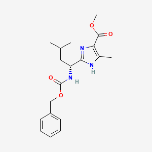 molecular formula C19H25N3O4 B2594396 methyl 2-((1R)-1-(((benzyloxy)carbonyl)amino)-3-methylbutyl)-5-methyl-1H-imidazole-4-carboxylate CAS No. 1881275-69-9