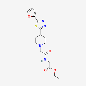 Ethyl 2-(2-(4-(5-(furan-2-yl)-1,3,4-thiadiazol-2-yl)piperidin-1-yl)acetamido)acetate