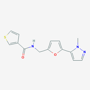 molecular formula C14H13N3O2S B2597027 N-[[5-(2-Methylpyrazol-3-yl)furan-2-yl]methyl]thiophene-3-carboxamide CAS No. 2415455-83-1