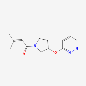 molecular formula C13H17N3O2 B2598549 3-Methyl-1-(3-(pyridazin-3-yloxy)pyrrolidin-1-yl)but-2-en-1-one CAS No. 2034580-20-4