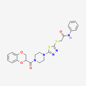 molecular formula C23H23N5O4S2 B2598617 2-((5-(4-(2,3-dihydrobenzo[b][1,4]dioxine-2-carbonyl)piperazin-1-yl)-1,3,4-thiadiazol-2-yl)thio)-N-phenylacetamide CAS No. 1105199-00-5