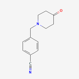 molecular formula C13H14N2O B2599613 4-[(4-Oxopiperidin-1-yl)methyl]benzonitrile CAS No. 1016863-24-3