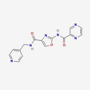 molecular formula C15H12N6O3 B2599885 2-(吡嗪-2-甲酰胺)-N-(吡啶-4-基甲基)恶唑-4-甲酰胺 CAS No. 1396852-51-9