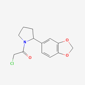 molecular formula C13H14ClNO3 B2603264 1-[2-(1,3-Benzodioxol-5-yl)pyrrolidin-1-yl]-2-chloroethanone CAS No. 2411318-79-9