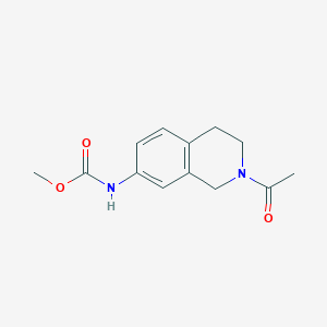 molecular formula C13H16N2O3 B2604108 甲基（2-乙酰基-1,2,3,4-四氢异喹啉-7-基）氨基甲酸酯 CAS No. 955757-90-1