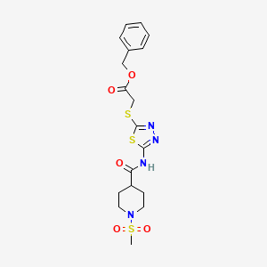 molecular formula C18H22N4O5S3 B2605273 Benzyl 2-((5-(1-(methylsulfonyl)piperidine-4-carboxamido)-1,3,4-thiadiazol-2-yl)thio)acetate CAS No. 1351649-34-7