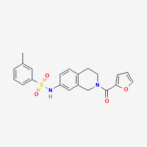 molecular formula C21H20N2O4S B2605774 N-(2-(furan-2-carbonyl)-1,2,3,4-tetrahydroisoquinolin-7-yl)-3-methylbenzenesulfonamide CAS No. 955649-78-2