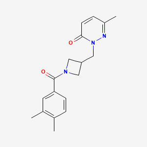 molecular formula C18H21N3O2 B2606714 2-[[1-(3,4-Dimethylbenzoyl)azetidin-3-yl]methyl]-6-methylpyridazin-3-one CAS No. 2310205-29-7