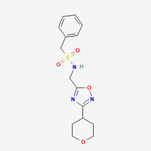B2606918 1-phenyl-N-((3-(tetrahydro-2H-pyran-4-yl)-1,2,4-oxadiazol-5-yl)methyl)methanesulfonamide CAS No. 2034291-76-2