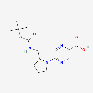 molecular formula C15H22N4O4 B2610255 5-[2-[[(2-Methylpropan-2-yl)oxycarbonylamino]methyl]pyrrolidin-1-yl]pyrazine-2-carboxylic acid CAS No. 2260931-96-0