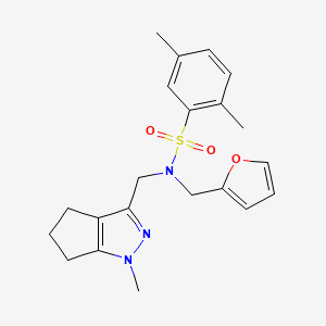 molecular formula C21H25N3O3S B2612232 N-(furan-2-ylmethyl)-2,5-dimethyl-N-((1-methyl-1,4,5,6-tetrahydrocyclopenta[c]pyrazol-3-yl)methyl)benzenesulfonamide CAS No. 1798488-18-2