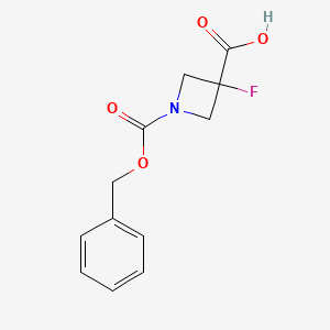 molecular formula C12H12FNO4 B2613376 1-[(苄氧羰基)羰基]-3-氟代氮杂环丙烷-3-羧酸 CAS No. 1781046-72-7