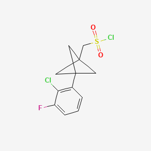 molecular formula C12H11Cl2FO2S B2613439 [3-(2-Chloro-3-fluorophenyl)-1-bicyclo[1.1.1]pentanyl]methanesulfonyl chloride CAS No. 2287286-38-6