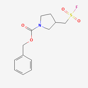 molecular formula C13H16FNO4S B2613442 Benzyl 3-[(fluorosulfonyl)methyl]pyrrolidine-1-carboxylate CAS No. 1936045-71-4