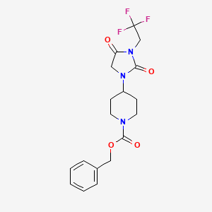 molecular formula C18H20F3N3O4 B2613914 4-[2,4-二氧代-3-(2,2,2-三氟乙基)咪唑烷-1-基]哌啶-1-甲酸苄酯 CAS No. 2097892-62-9